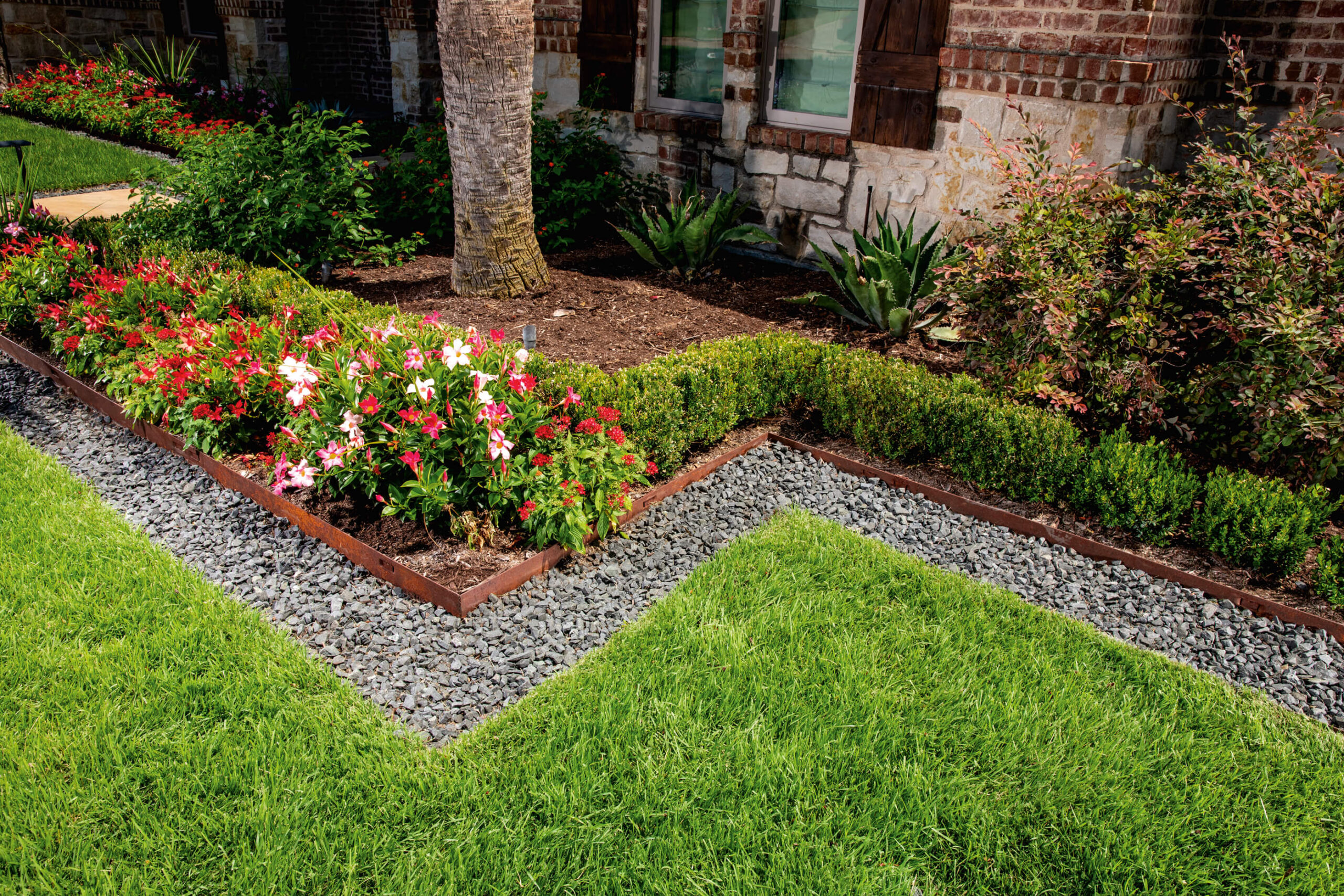 Classic Steel Edging between a garden and a rock border